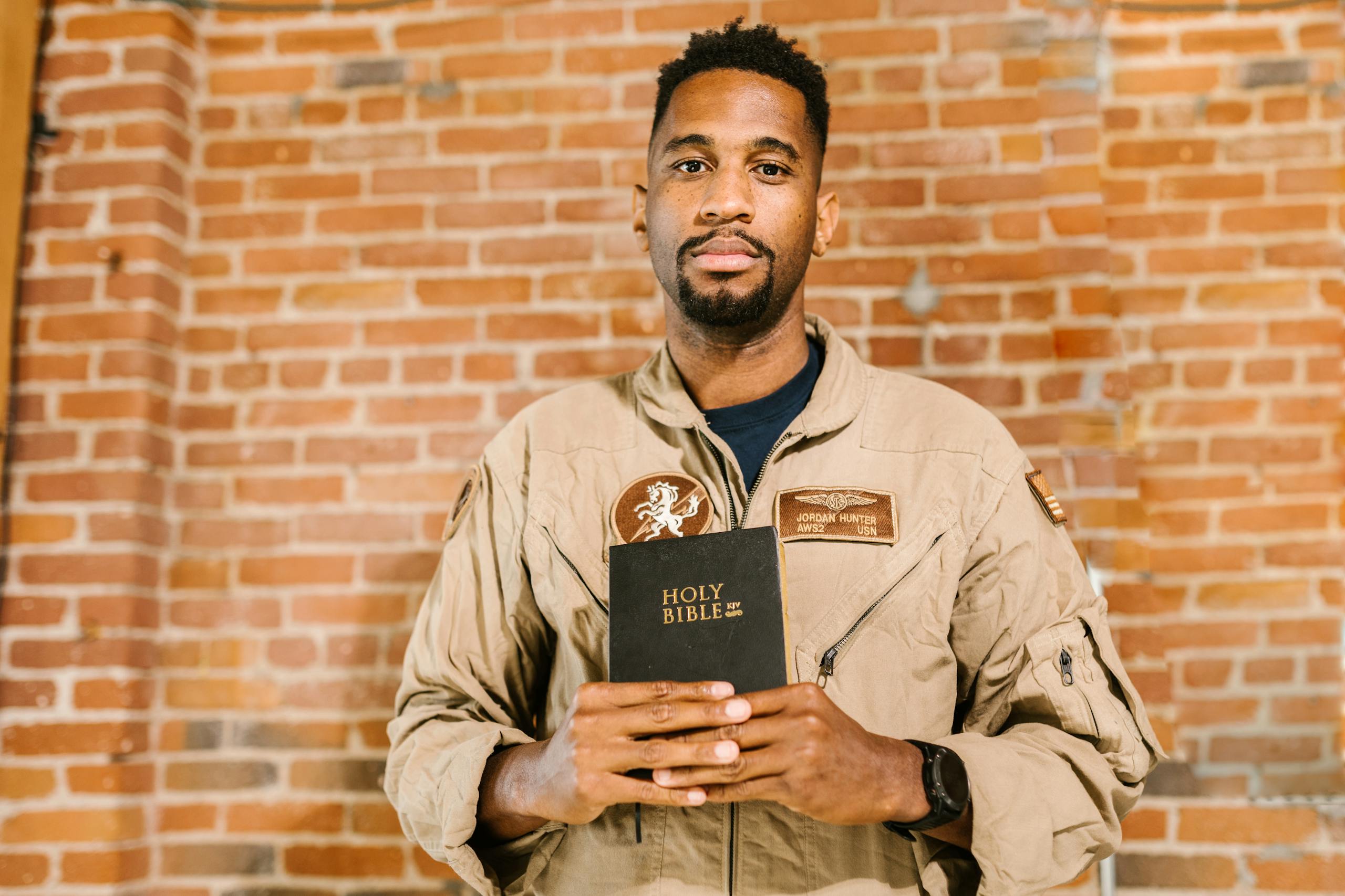 Photo of Soldier Holding Holy Bible